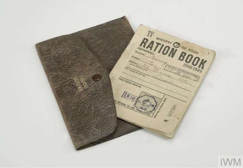 Image of a ration book commissioned by the UK Ministry of Food for the years 1948-49. It has yellowing pages and a leather pouch to be kept in.