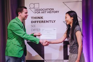 Xintong Cindy Liu receiving her award during a ceremony held at the University of Cambridge