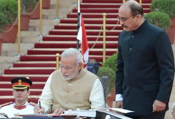Shri Narendra Modi taking oath as the 15th Prime Minister of India.