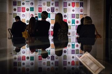 Visitors viewing the modern suffrage wall. This display of modern suffrage champions mirrored the exhibition’s postcard display of the original suffragists, encouraging visitors to reflect on continuity and change.  