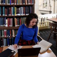 student studying in library