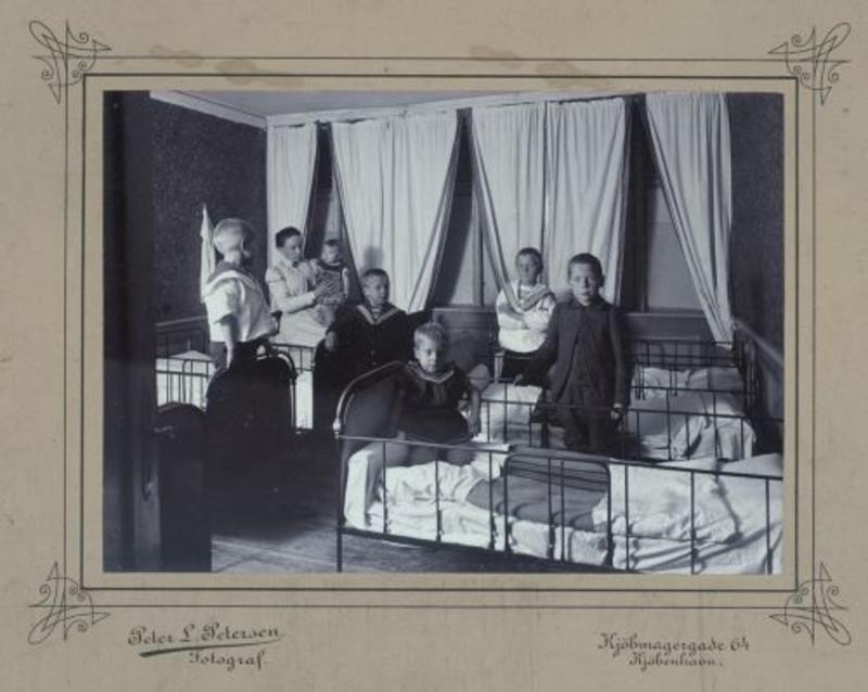 A bedroom for boys at the admissions home of the Organisation of N. Bang in Copenhagen, undated approximately 1900. Peter L. Petersen, Archive of the Organisation of N. Bang, The Danish National Archives.