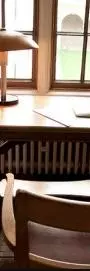 An old fashioned desk by a window