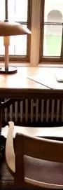 An old fashioned desk by a window